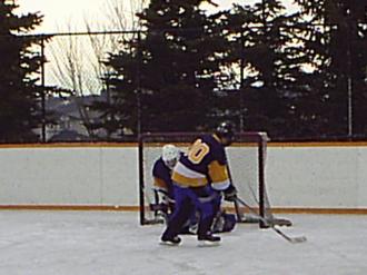Me (Ryan Hellyer) stopping in front of my own goalie in the Tuscany outdoor ice hockey tournament